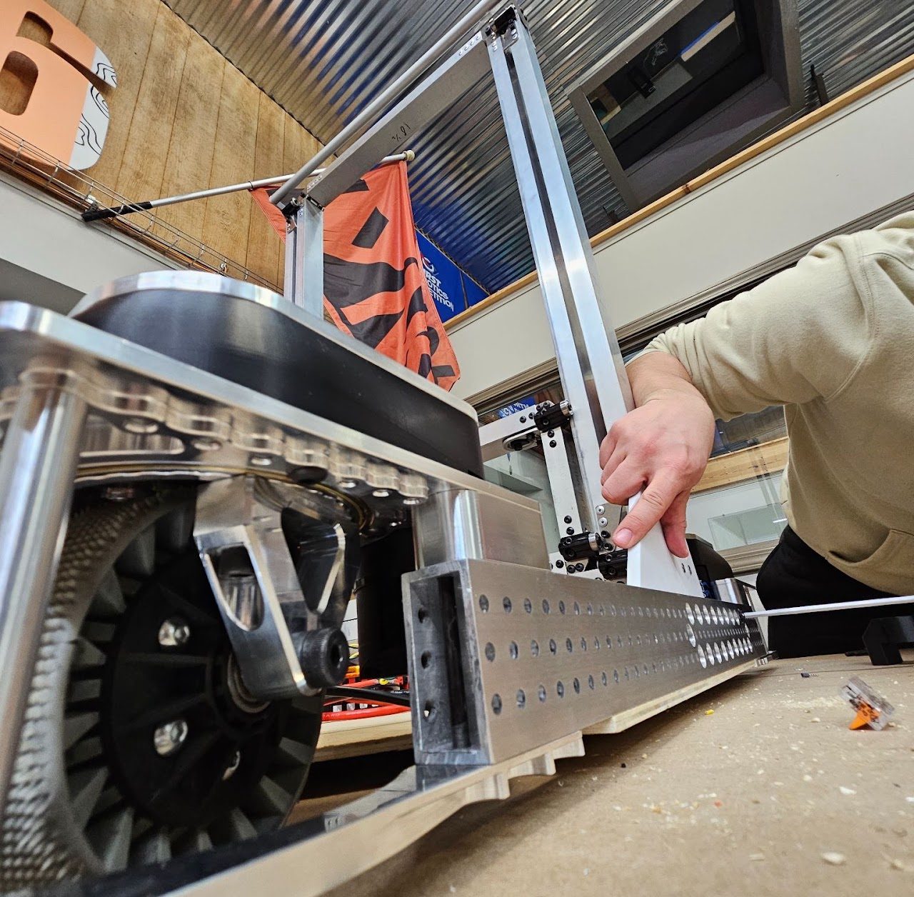 A mentor assembling the 2026 robot chassis in the LYNK workshop